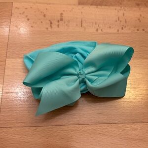 4.5 inch dark mint green gingham bow on a stretchy headband